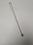 A 9ct yellow gold curblink neckchain, hung with an 18K yellow gold mounted Tahitian pear shaped pear