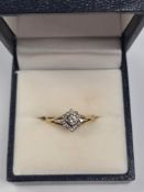 18ct yellow gold diamond cluster ring with central round brilliant cut diamond surrounded by smaller