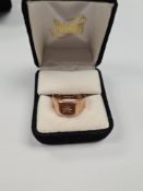 9ct rose gold signet ring with squared panel with starburst set single diamond, size W, marked 375,