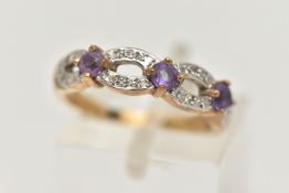 A 9CT GOLD AMETHYST AND DIAMOND RING, set with three raised, circular cut amethysts, claw set to