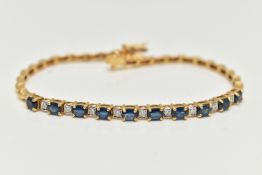 A SAPPHIRE AND DIAMOND BRACELET, designed as a central section of ten oval cut sapphires interspaced