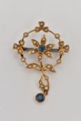 AN EDWARDIAN SPLIT PEARL AND SAPPHIRE PENDANT, of circular outline with a central flower set with