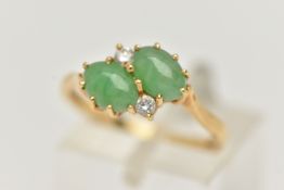 AN 18CT GOLD JADE AND DIAMOND RING, of crossover design, claw set horizontally with two oval jade