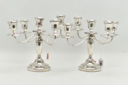A PAIR OF ELIZABETH II SILVER FIVE LIGHT CANDELABRAS, baluster stems, stepped circular loaded