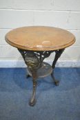 A CAST IRON CIRCULAR PUB TABLE, with a walnut top, diameter 61cm x height 70cm (condition report: