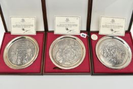 THREE ELIZABETH II SILVER BIRMINGHAM MINT LIMITED EDITION CHRISTMAS PLATES, 1975-1977, repoussé