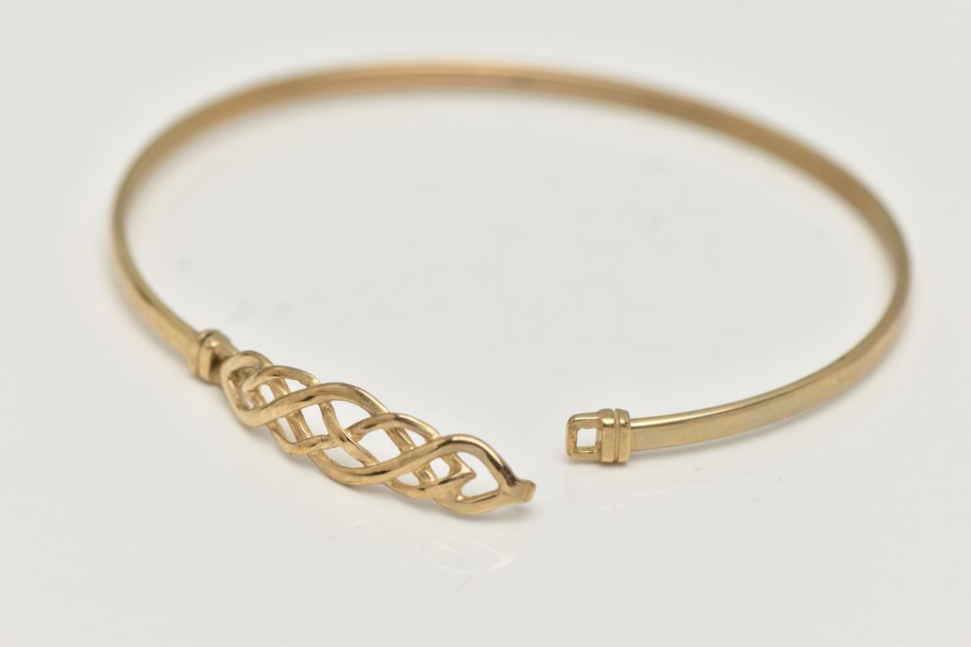 A 9CT GOLD BANGLE, a Celtic design light weight bangle, fitted with a hook fastening, hallmarked 9ct - Image 3 of 4