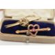 TWO EARLY 20TH CENTURY BROOCHES, the first an open work heart with bar set with a single pink - Image 2 of 4