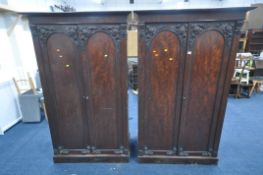 A NEAR PAIR OF VICTORIAN MAHOGANY DOUBLE DOOR WARDROBES, with foliate moulding, one wardrobe