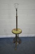 A FRENCH BRASS AND ONYX STANDARD LAMP, with a circular shelf, standing on triple foliate legs with
