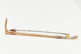 AN EARLY 20TH CENTURY YELLOW METAL RIDING CROP BROOCH, stamped 9ct, makers mark A&W, length 78mm,