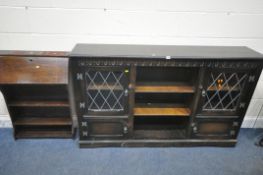 AN EARLY 20TH CENTURY OAK BOOKCASE, with double lead glazed doors, double cupboard doors, flanking