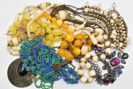 A BAG OF ASSORTED BEADED COSTUME JEWELLERY, to include a carved bone bead necklace, orange and