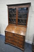 A GEORGIAN MAHOGANY BUREAU BOOKCASE, the top with blind fretwork and double astragal glazed doors,