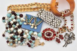 A BAG OF COSTUME JEWELLERY, to include two paste set necklaces, a three strand beaded necklace, a