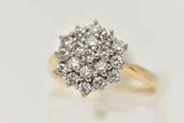 A YELLOW METAL DIAMOND CLUSTER RING, cluster set with round brilliant cut diamonds, estimated