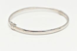 A WHITE METAL HINGED BANGLE, polished bangle, fitted with a figure of eight safety clasp, stamped