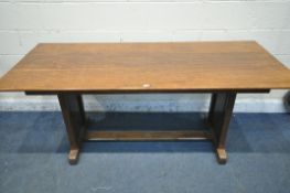 AN OAK TRESTLE DINING TABLE, united by a floor stretcher, length 182cm x 87cm x height 77cm (