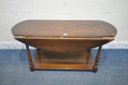 A REPRODUCTION OAK DROP LEAF COFFEE TABLE, on turned legs united by an undershelf, length 121cm x
