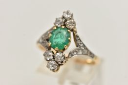 AN 18CT GOLD EMERALD AND DIAMOND DRESS RING, centrally set with an oval cut emerald in an eight claw