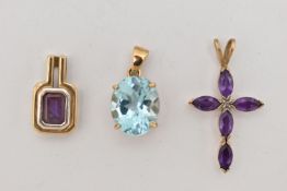 THREE 9CT GOLD GEM PENDANTS, to include an oval claw set topaz, an amethyst and diamond set cross,