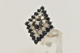 AN 18CT WHITE GOLD DIAMOND AND SPINEL CLUSTER RING, designed as a marquise shape, four tier
