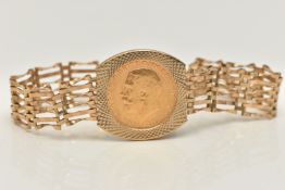A 9CT GOLD GATE BRACELET WITH FULL SOVEREIGN, a wide six bar gate bracelet, with a full George V