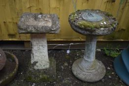A WEATHERED COMPOSITE SUNDIAL, on a circular base, diameter 43cm x height 63cm, and a composite bird
