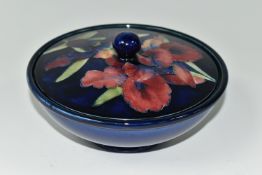 A MOORCROFT POTTERY 'ORCHID' PATTERN COVERED BOWL, tube lined with pink and purple orchids on a blue