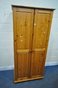 A MODERN PINE DOUBLE DOOR WARDROBE, width 87cm x depth 57cm x height 186cm (condition report: