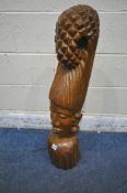 A SOLID TEAK CARVED BUST OF A WOMAN, with tall hair and piercings, height 85cm (condition report: