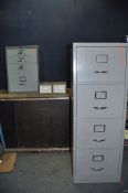A VINTAGE FOUR DRAWER FILING CABINET WITHOUT KEY, a metal under desk cabinet with three shallow