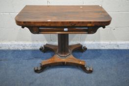 A REGENCY ROSEWOOD FOLD OVER CARD TABLE, the revolving top enclosing a green baize playing