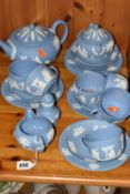 A WEDGWOOD BLUE JASPERWARE TEA SET, comprising a teapot, covered sugar bowl, milk jug, sugar
