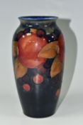 A MOORCROFT POTTERY 'POMEGRANATE' PATTERN VASE, of ovoid form, tube lined with pomegranates, berries