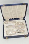 A CASED SILVER MOUNTED DRESSING TABLE SET, to include two brushes, a mirror and comb, with