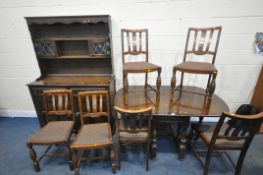 AN EARLY 20TH CENTURY OAK EIGHT PIECE DINING SUITE, comprising a gate leg table, open width 145cm