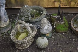 A SELECTION OF WEATHERED COMPOSITE GARDEN ORNAMENTS, to include a Humpty Dumpty planter, a basket