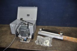 AN ELU MOF 177 1/2in ROUTER in metal case with parallel guide, spare collet, extractor attachment,