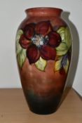 A MOORCROFT POTTERY FLAMBÉ 'CLEMATIS' PATTERN VASE, of ovoid form, tube lined with red and purple