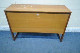A MID CENTURY TEAK RECORD CABINET, the fall front door enclosing various divisions, raised on