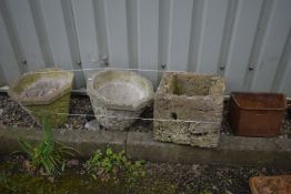A PAIR OF COMPOSITE OCTAGONAL BRICK EFFECT PLANTERS, along with a square planter and a water