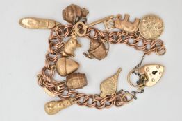 A 9CT GOLD CHARM BRACELET, double curb link bracelet, some links stamped 9.375, fitted with a