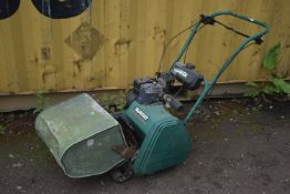 A QUALCAST CLASSIC PETROL 35s CYLINDER LAWNMOWER, with an odd grassbox and aerator (condition