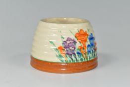 A CLARICE CLIFF 'CROCUS' HONEYPOT BASE, painted with orange, blue and purple crocus flowers on a