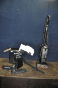 A SHARK NZ801UKTDB40 POWERED LIFT AWAY VACUUM CLEANER and a Nespresso Inissia coffee machine (