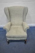 A GREEN UPHOLSTERED WINGBACK ARMCHAIR, width 75cm x depth 87cm x height 95cm (condition report: