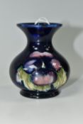 A MOORCROFT POTTERY SMALL 'PANSY' PATTERN VASE, with flared neck, tube lined with purple pansies
