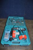 A MAKITA 8391D 18V DRILL IN CASE with two batteries, charger and drills and driver bits (Condition