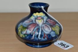 A MOORCROFT POTTERY 'COLUMBINE' PATTERN VASE, of squat form, tube lined with yellow, pink and purple